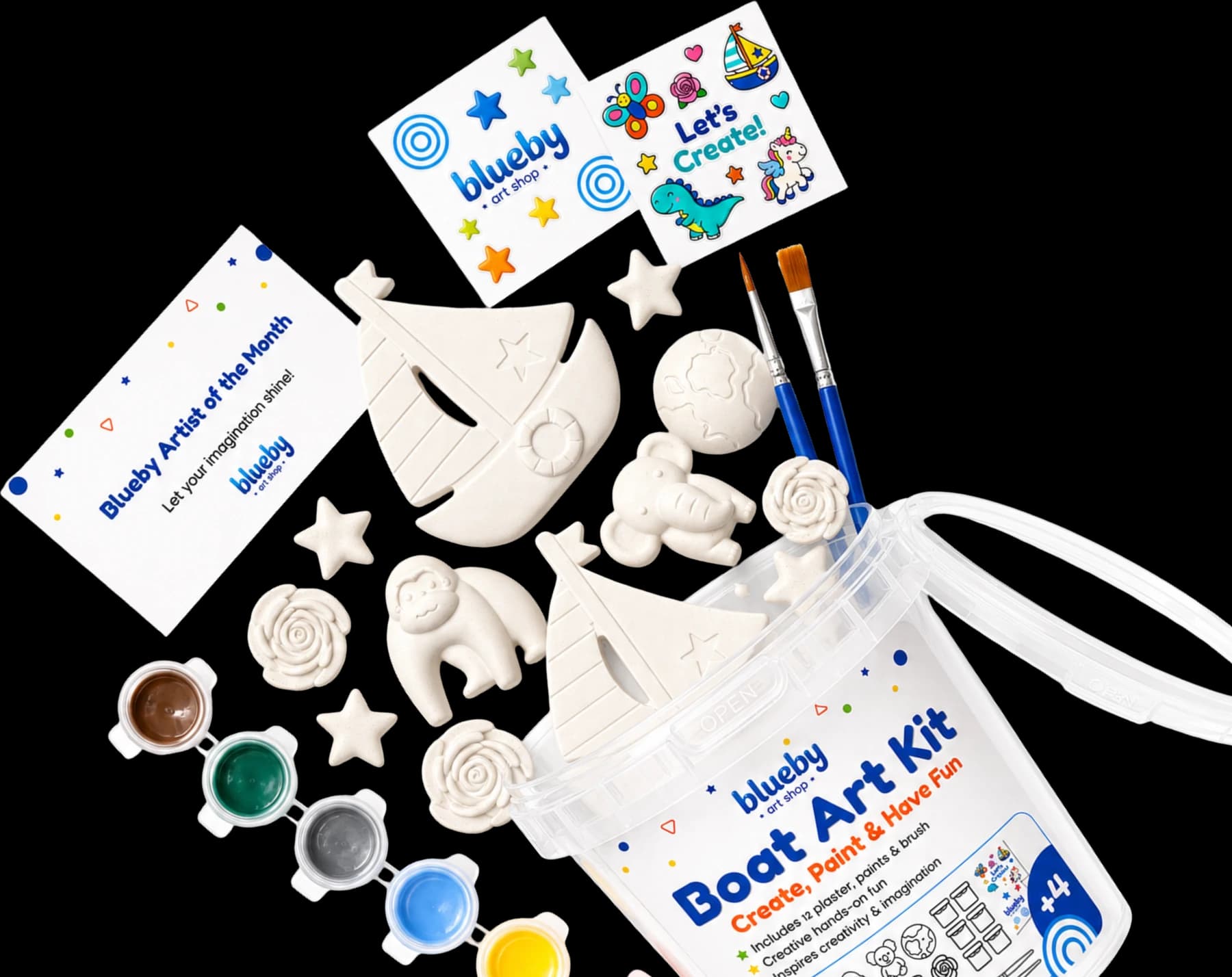 Everything inside a Blueby Boat Art Kit: plaster figurines, paint pots, brushes, sticker sheets and the Artist of the Month card